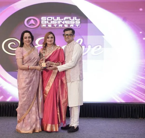 Hema Malini presenting an award to Harpreet Kaur
